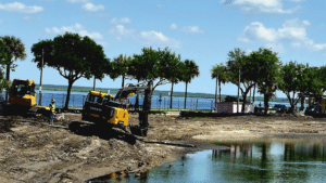 Construction trucks make progress on Lake Carola Project which began in March 2026.