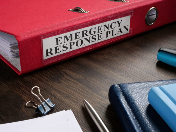 binder with an emergency plan sticker on it.