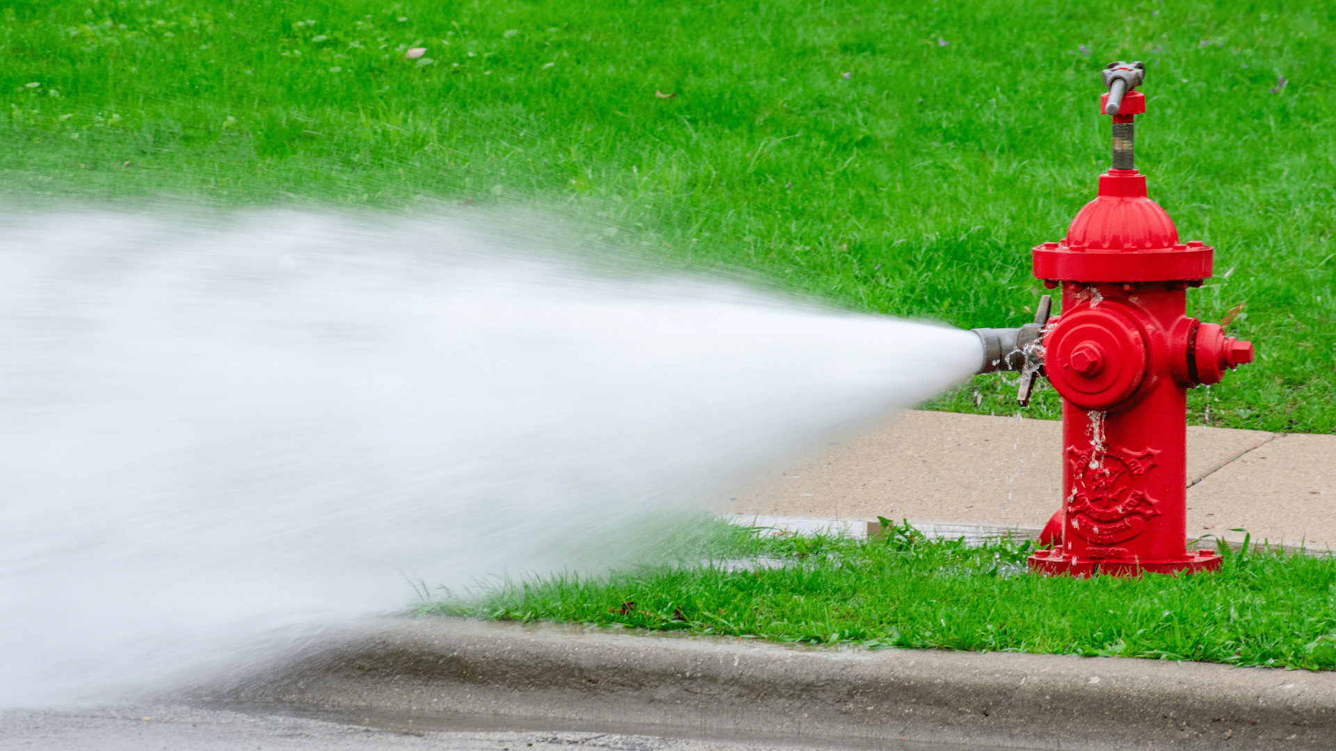 Closeup of fire hydrant being flushed by public works during spring maintenance